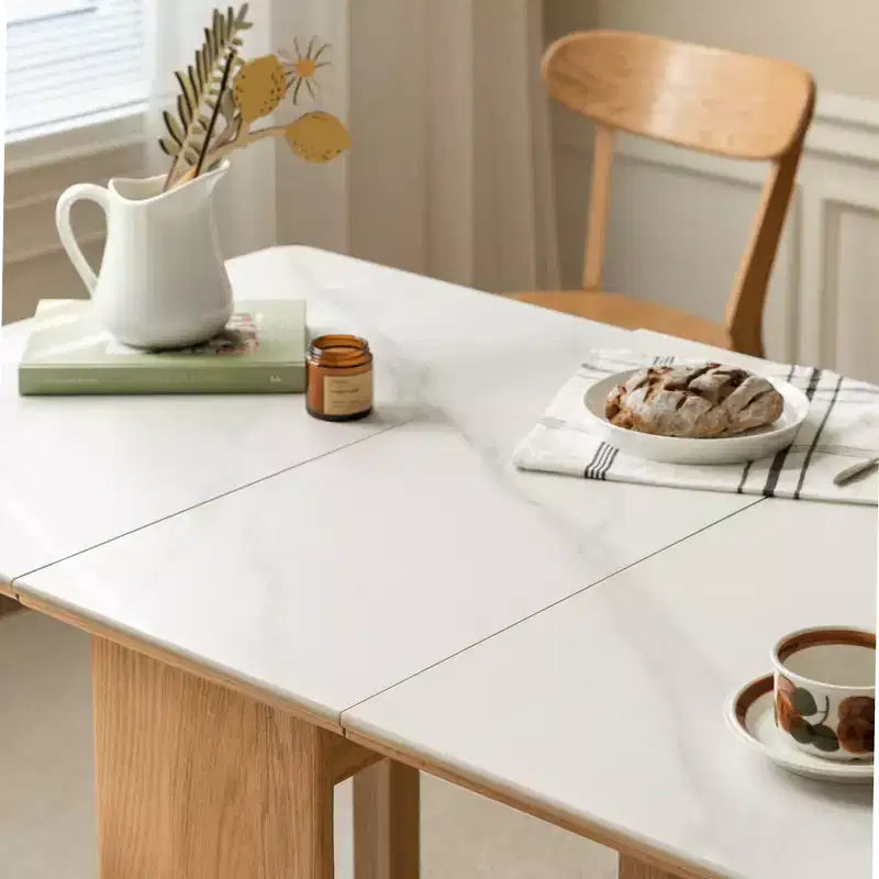 Table à manger extensible moderne avec pieds en chêne massif et plateau en pierre, pour 4 à 6 personnes