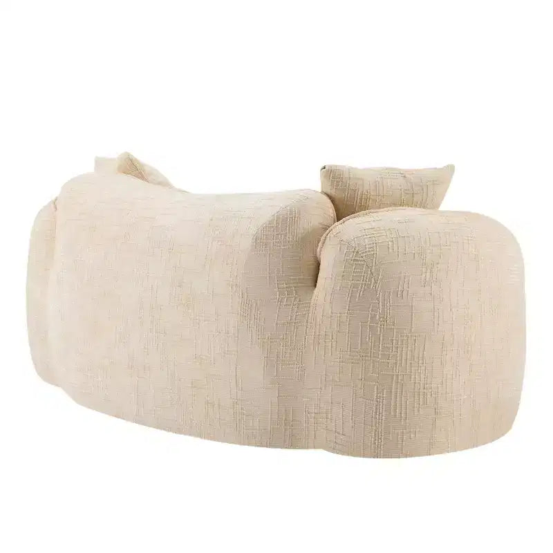 Canapé incurvé 2 places beige avec accoudoirs et 2 coussins, design compact pour toute pièce