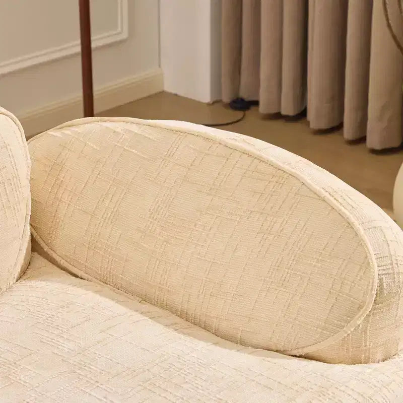 Canapé incurvé 2 places beige avec accoudoirs et 2 coussins, design compact pour toute pièce