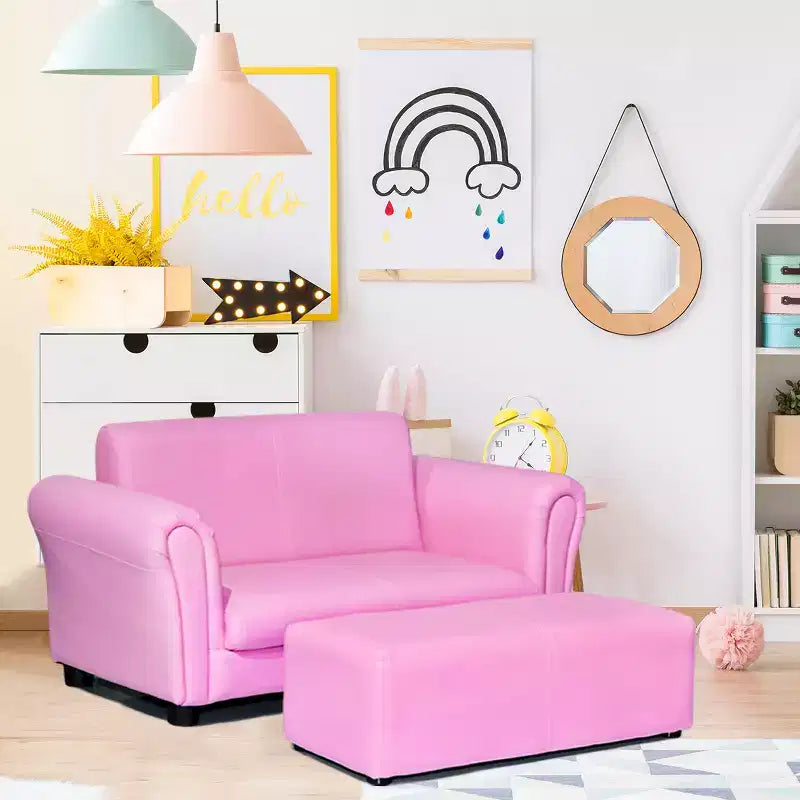 Canapé rose pour enfants avec accoudoirs et pouf