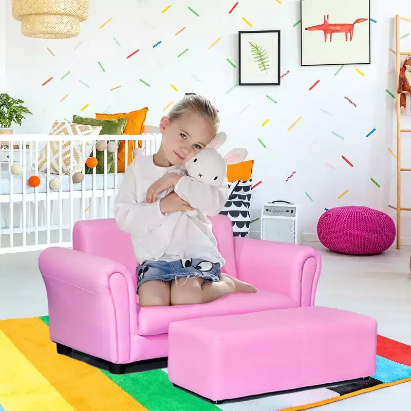 Canapé rose pour enfants avec accoudoirs et pouf