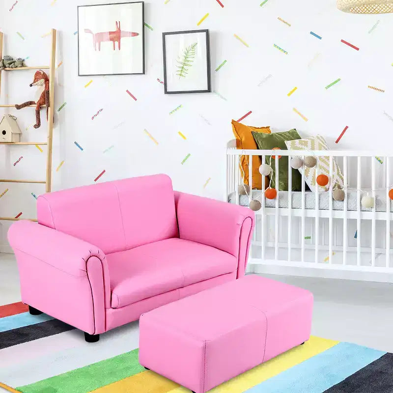 Canapé rose pour enfants avec accoudoirs et pouf